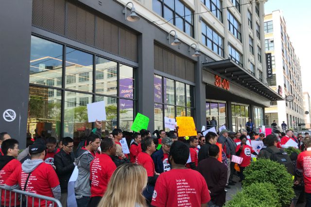 Drivers rally outside Uber's headquarters in Long Island City on Wednesday